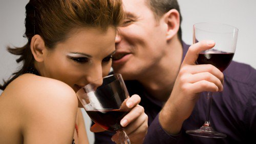 couple-flirting-while-drinking-wine-1